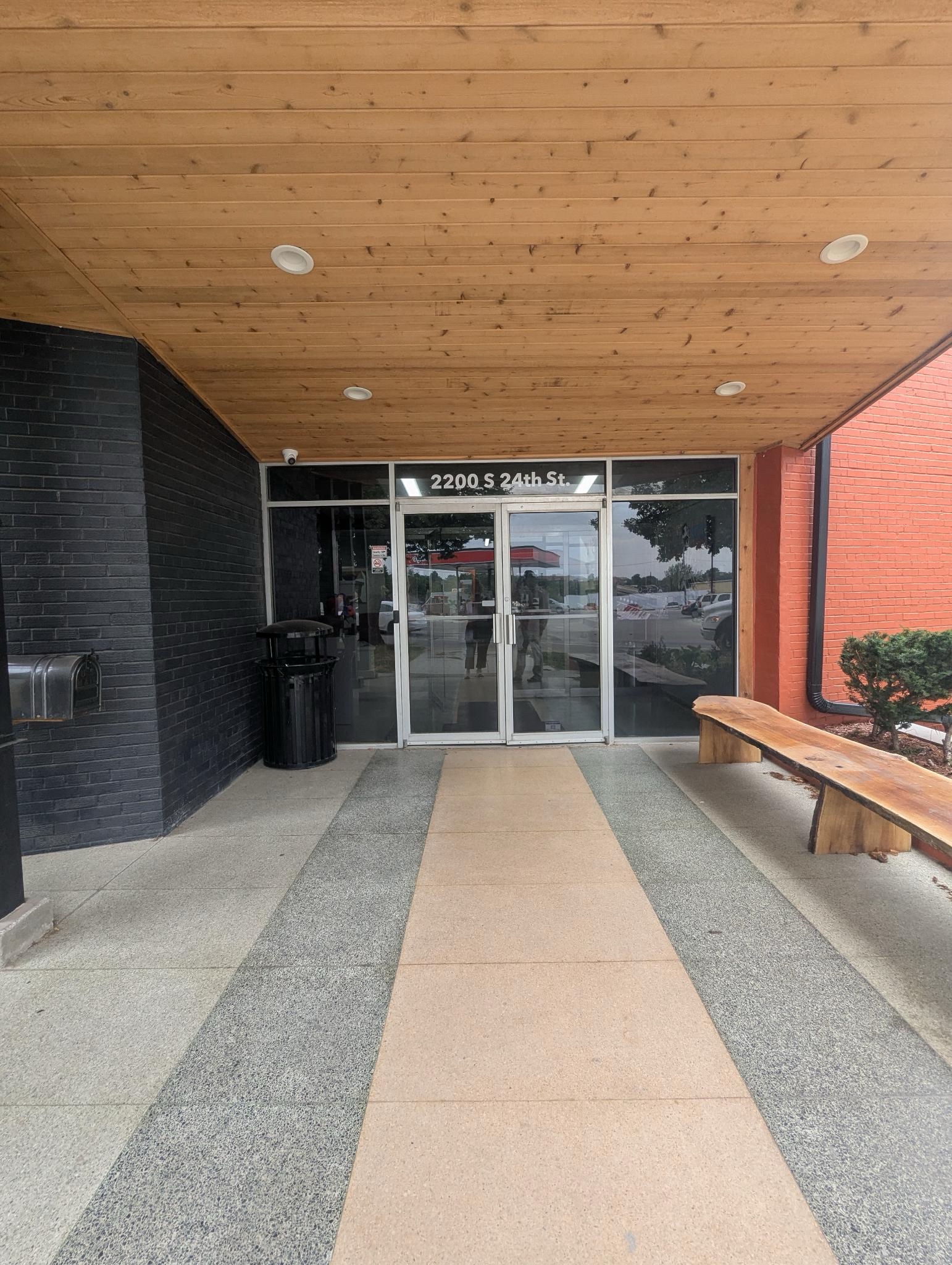 A photo of the exterior of the Clover24 glass doors